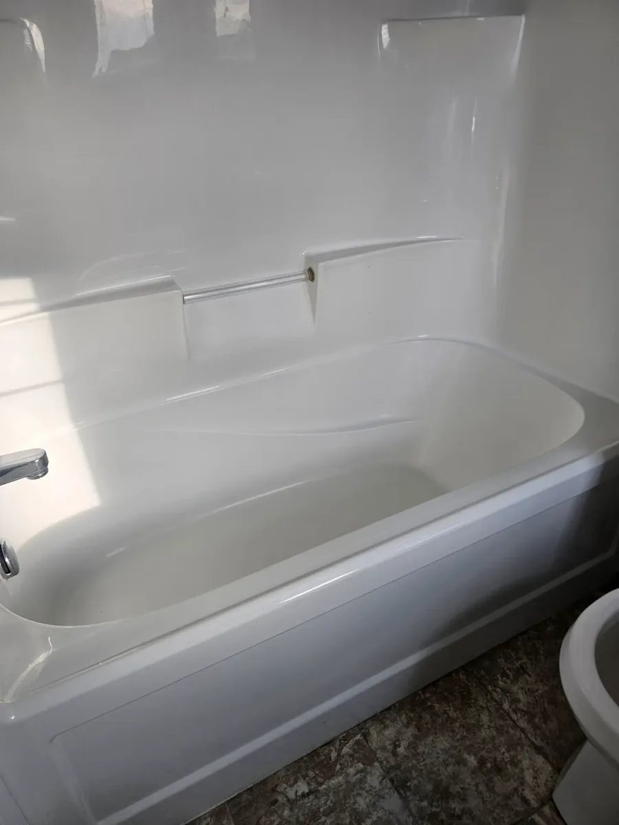 Spotless gleaming bathtub after professional deep cleaning service
