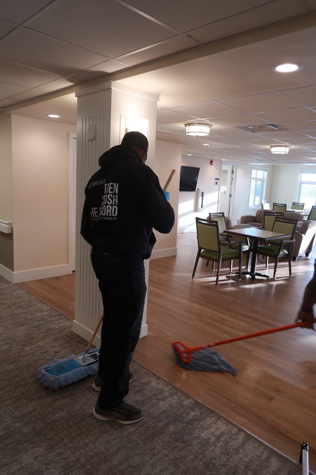 Kanians team member mopping commercial facility floor