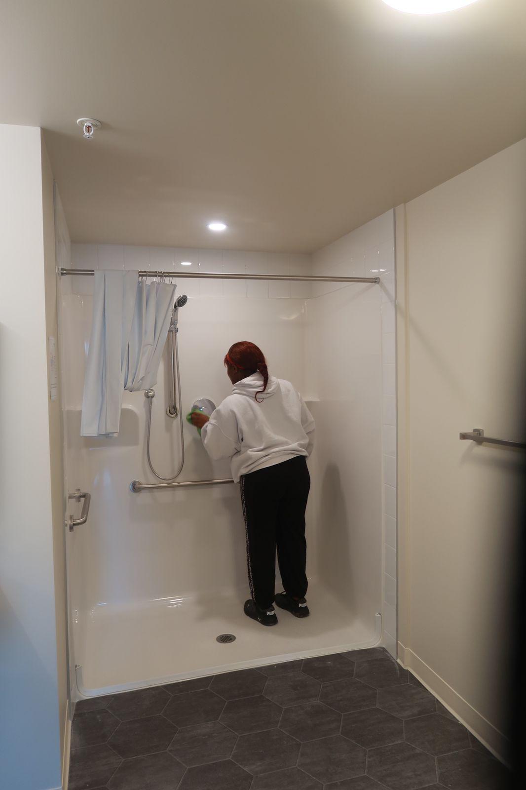 Scrubbing a commercial shower